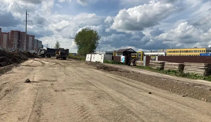 В Красноярске строят двухполосную дорогу к новой школе на Бугаче